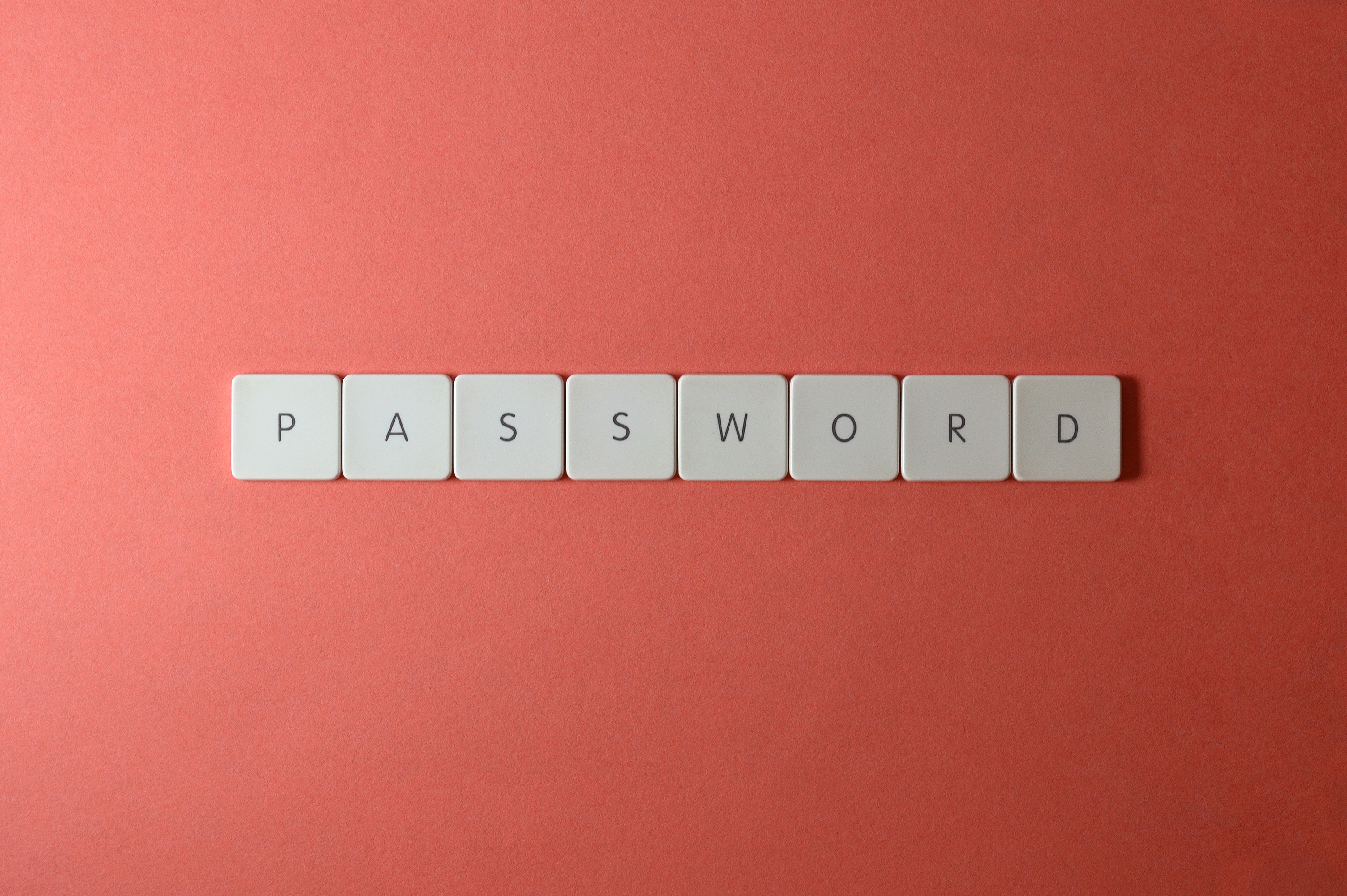 password written in scrabble tiles