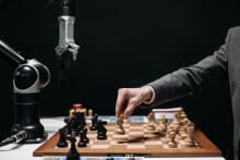 man and machine competing in chess